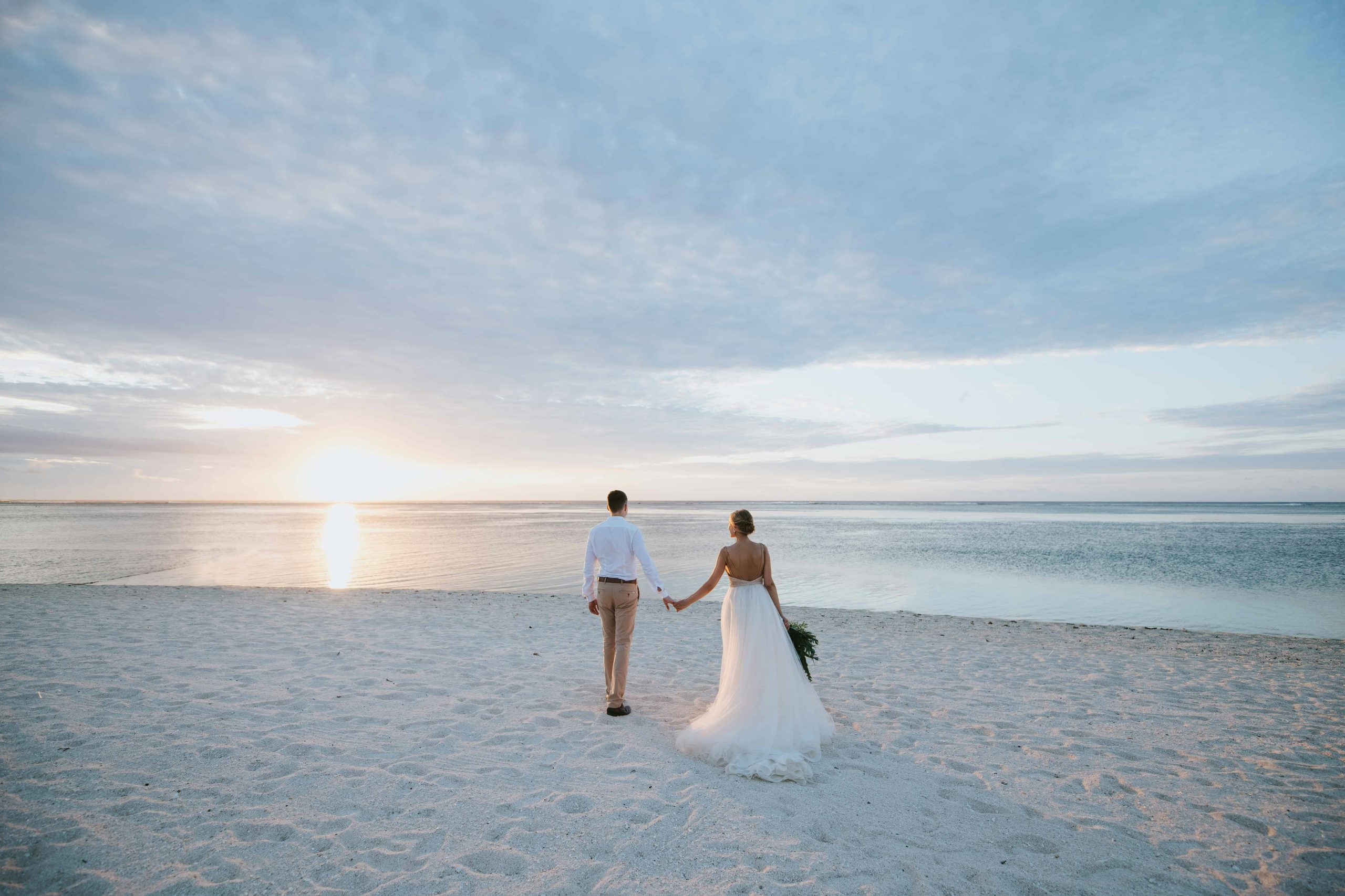 bride and groom at the beach